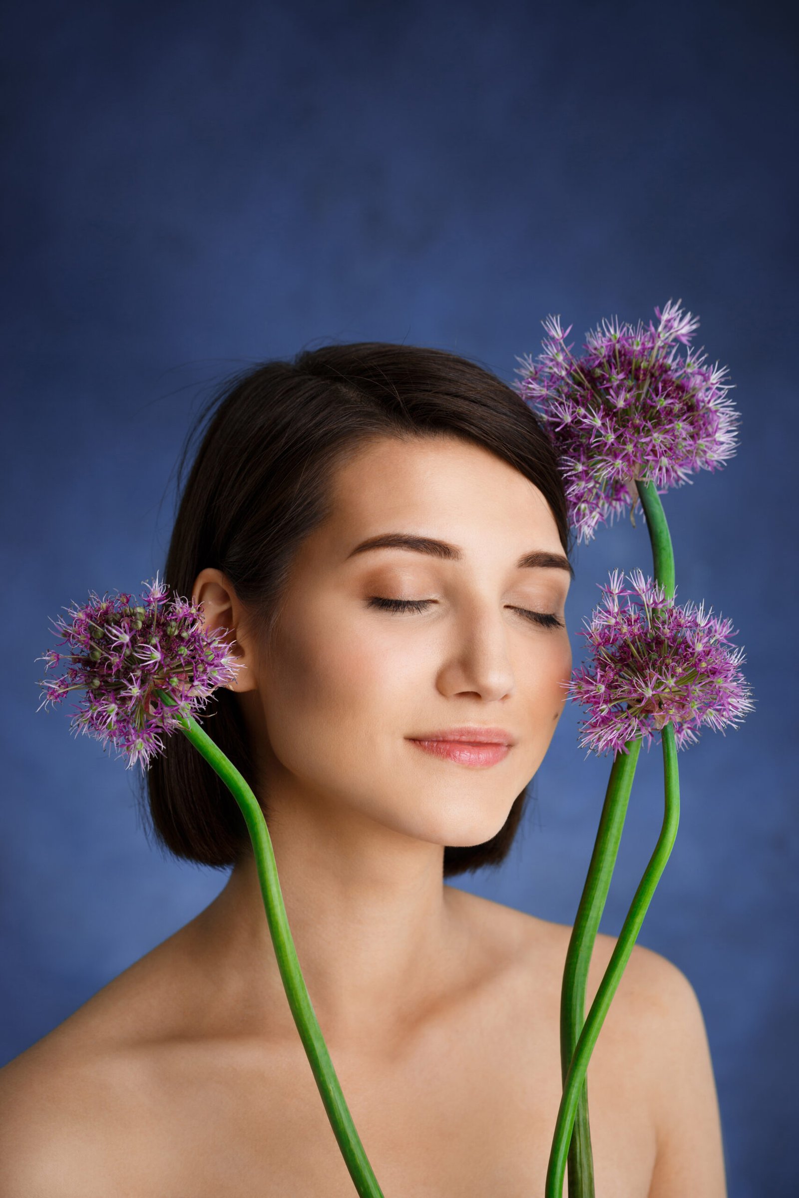 https://minusthreadingsalon.com/wp-content/uploads/2025/05/close-up-portrait-tender-young-woman-with-lilac-flowers-blue-wall-scaled.jpg